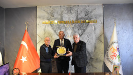 Başkan Yılmaz’a başarı plaketi